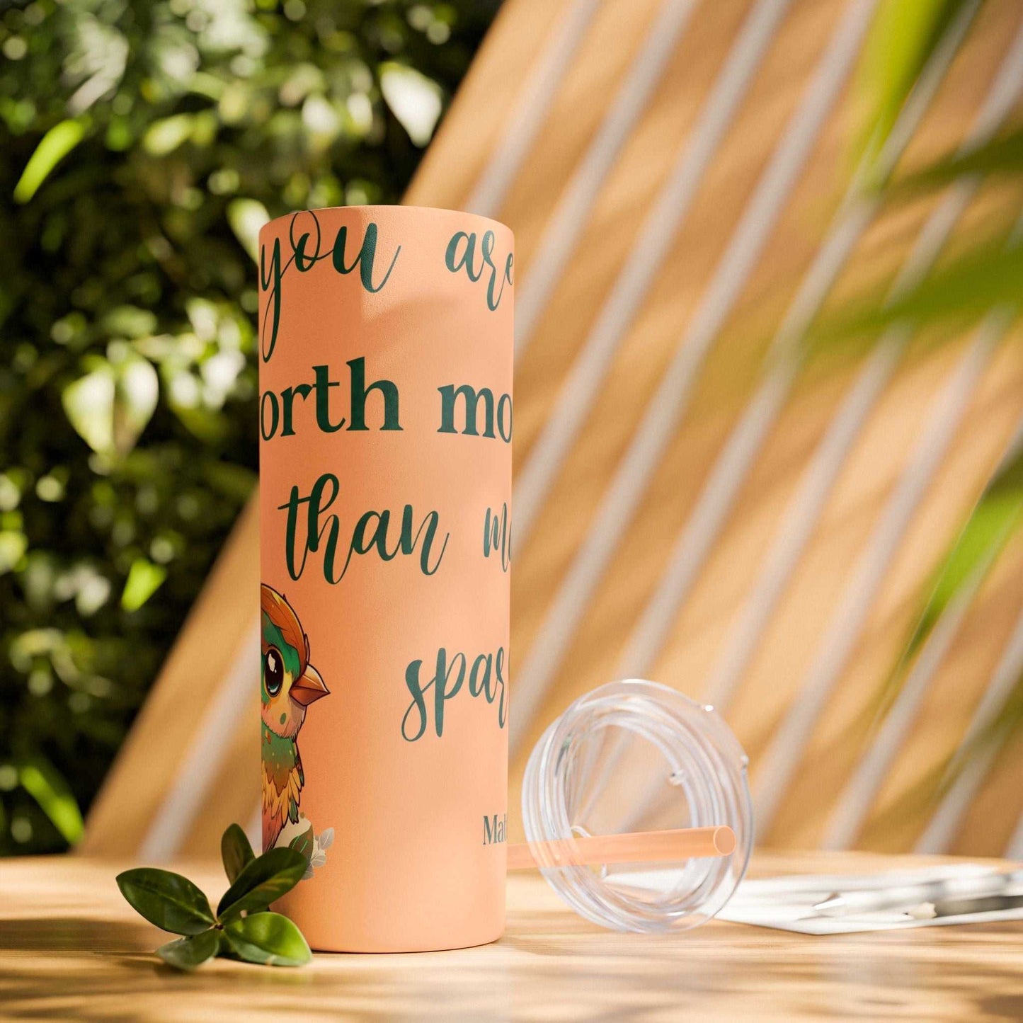 Stainless steel tumbler with "Worth More Than Sparrows" design, 20oz, keeps drinks hot or cold, eco-friendly.