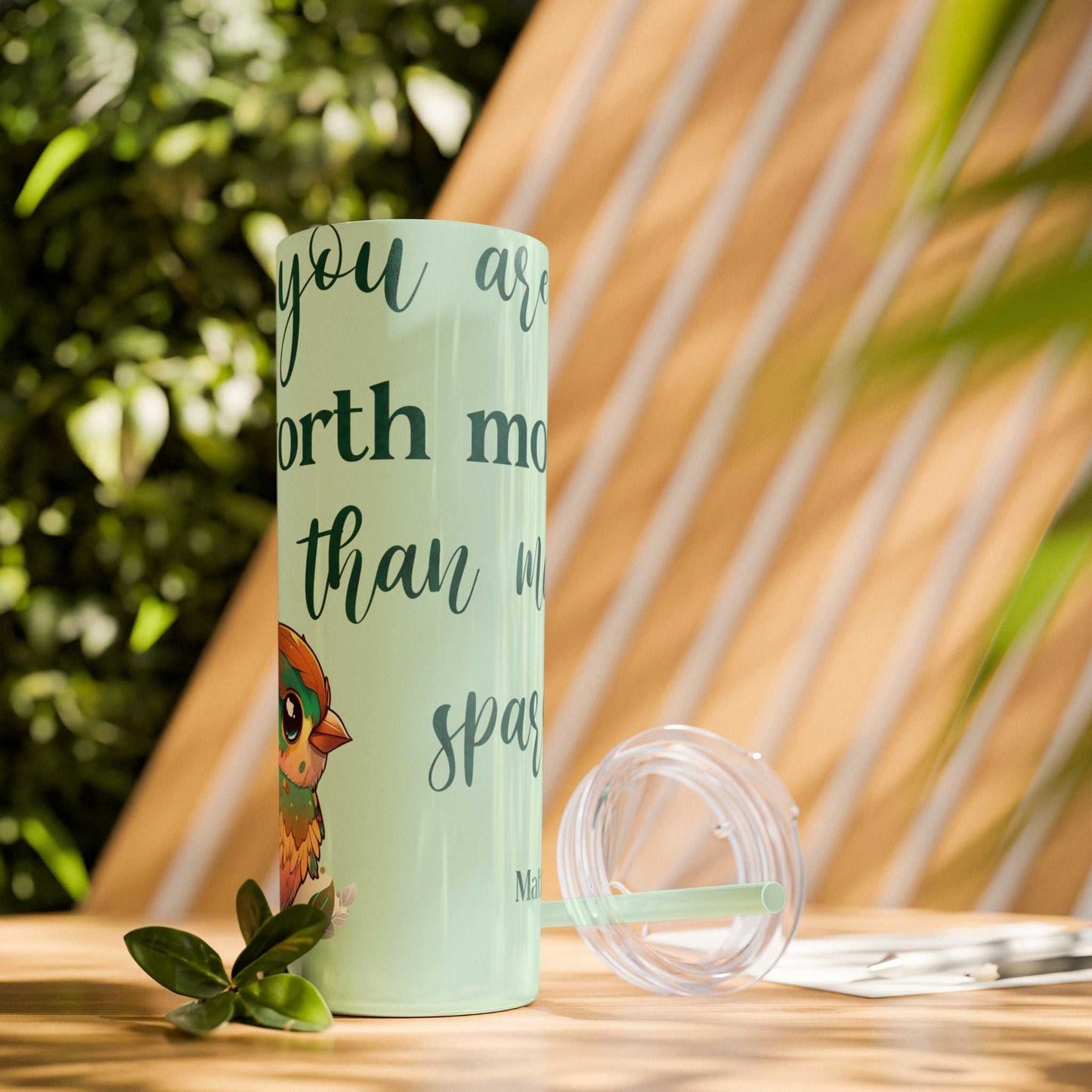 Stainless steel tumbler with "Worth More Than Sparrows" design, lid, and straw.