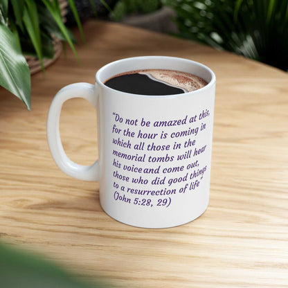 Ceramic coffee cup with a happy couple hugging graphic, vibrant colors, and an inspirational quote on a wooden table.