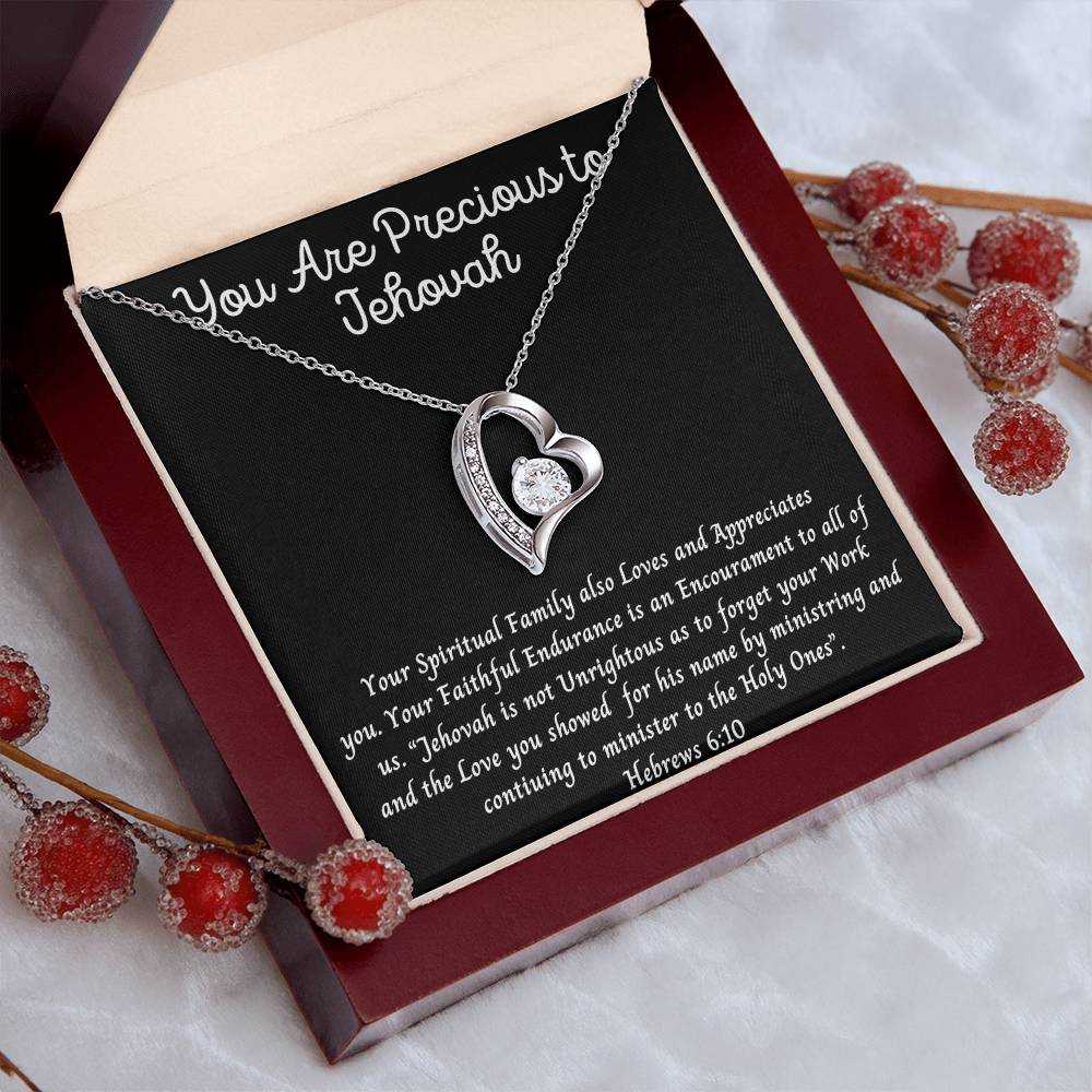 Necklace featuring "You Are Precious" heart pendant with crystal accents, available in white or yellow gold finish, displayed in a luxury gift box.