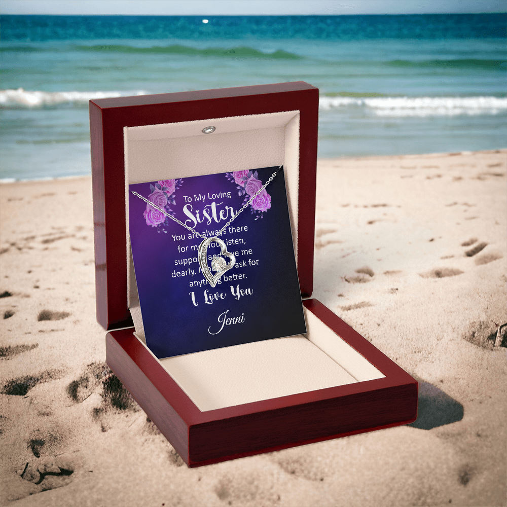 Necklace with heart-shaped pendant and personalized message card in a luxury box on the beach.