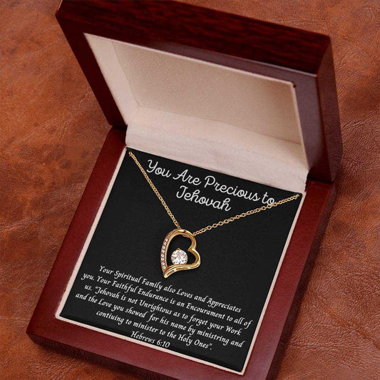 Heart pendant necklace with CZ crystals, featuring "You Are Precious" inscription, available in white or yellow gold finish, displayed in luxury gift box.