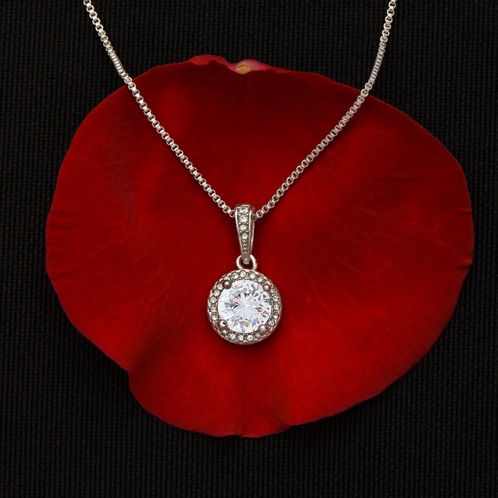 Eternal Hope Necklace with cubic zirconia on red petal background.