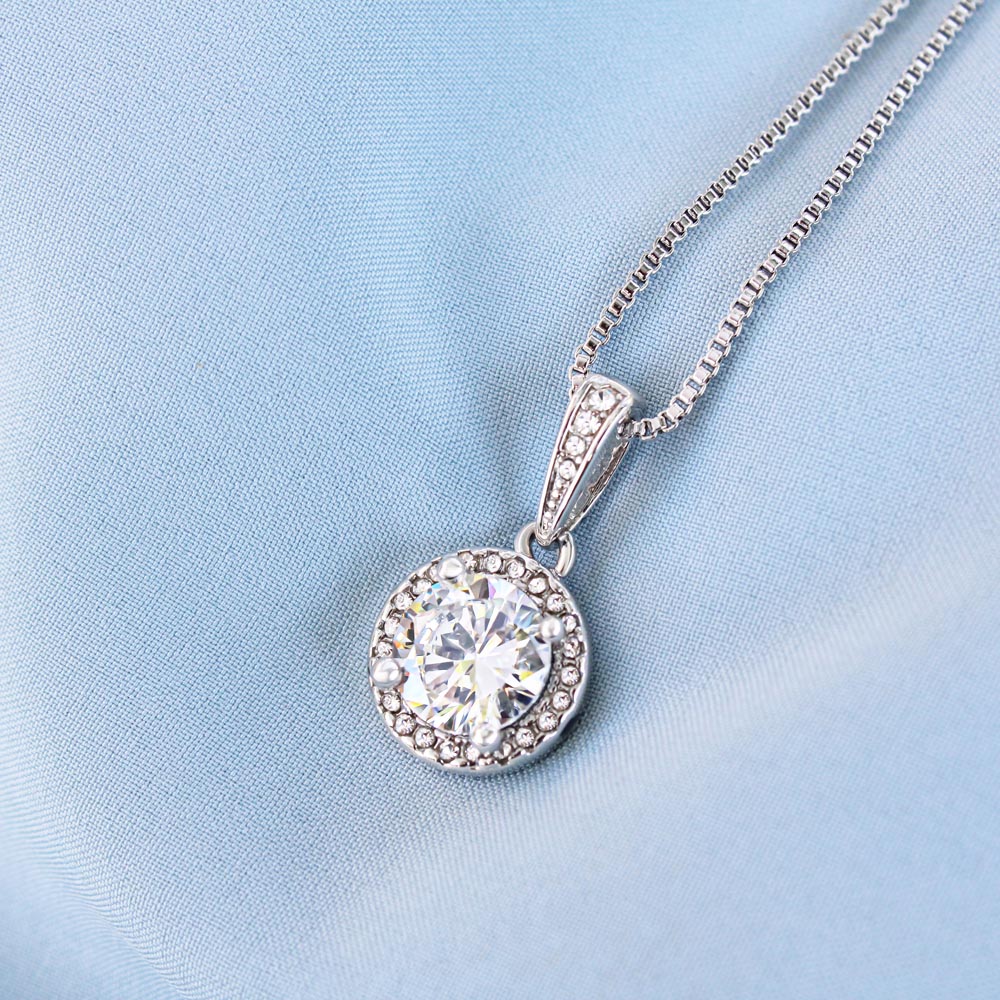 Eternal Hope Necklace with cushion-cut cubic zirconia center and CZ accents on a box chain.