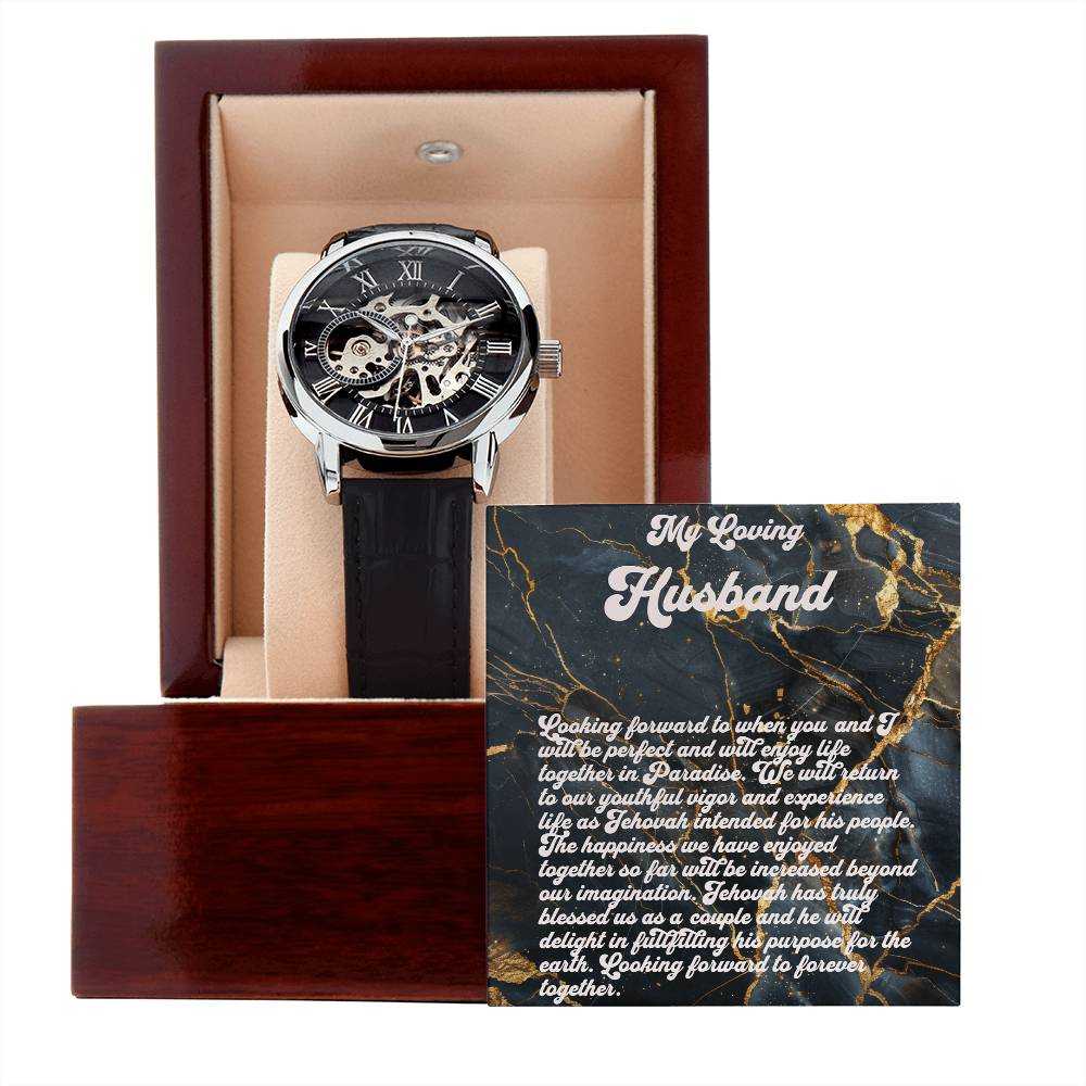 Luxury men's skeleton watch with black leather strap and open dial in a mahogany-style gift box.