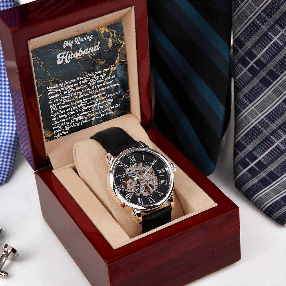 Luxury men's watch with skeleton dial in mahogany-style box, black leather strap, automatic movement.