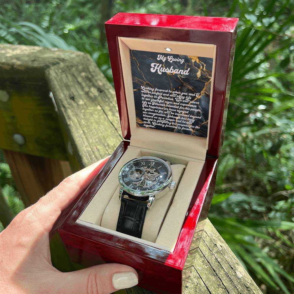 Man's Open Works Watch with skeleton dial and black leather strap in a mahogany-style gift box.