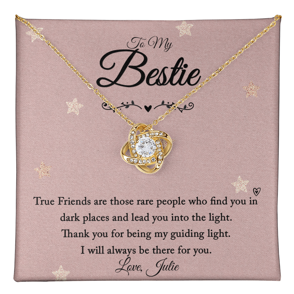 Love Knot Necklace with Personalized Message Card for Friend featuring a gold chain and cubic zirconia pendant on a heartfelt background.