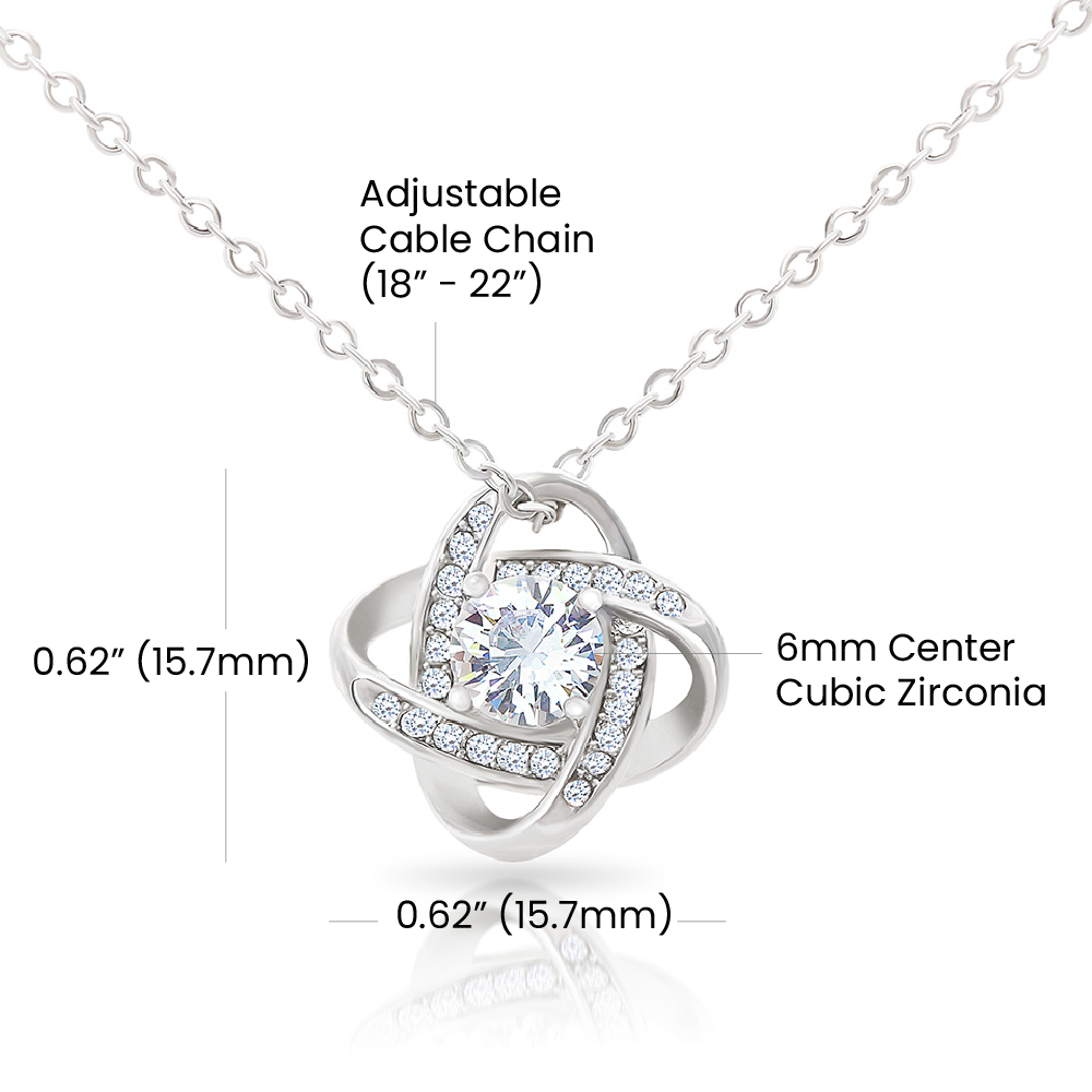 Necklace with love knot pendant featuring 6mm cubic zirconia and adjustable chain.