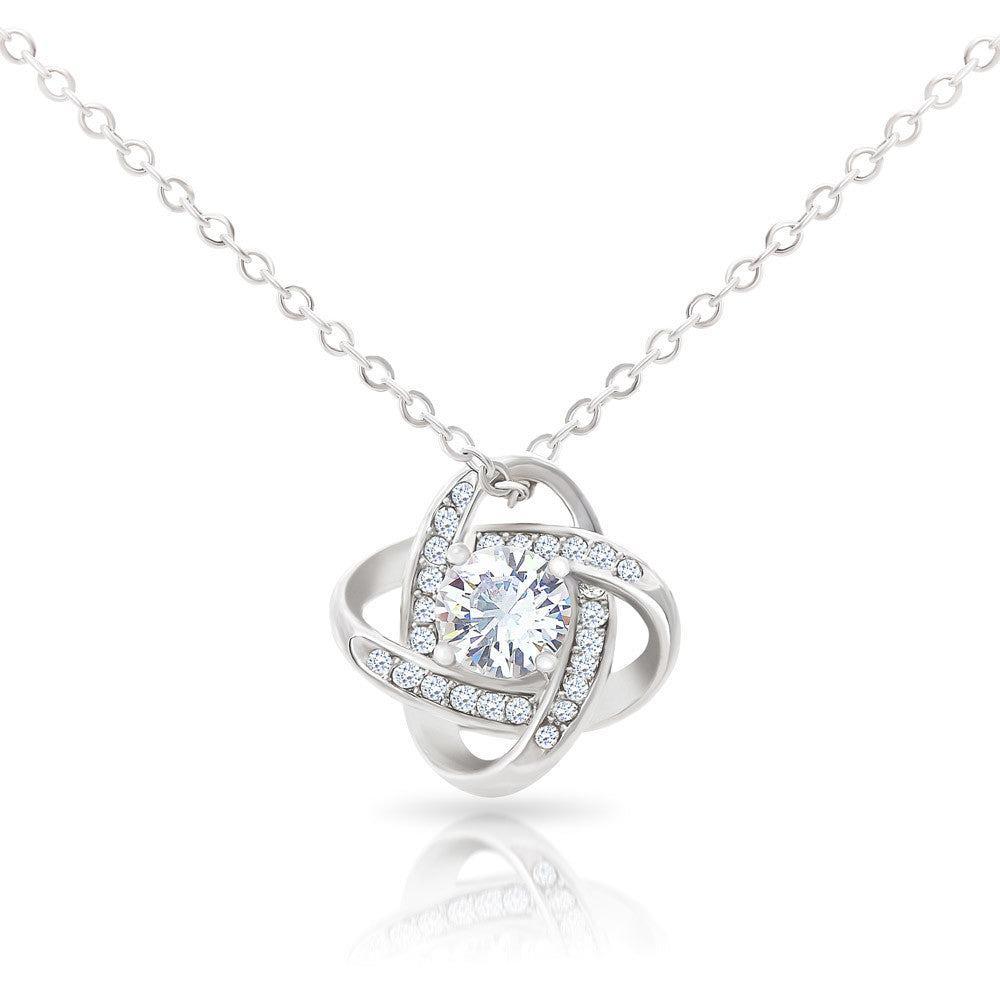 Love Knot Necklace with cubic zirconia pendant on adjustable chain.