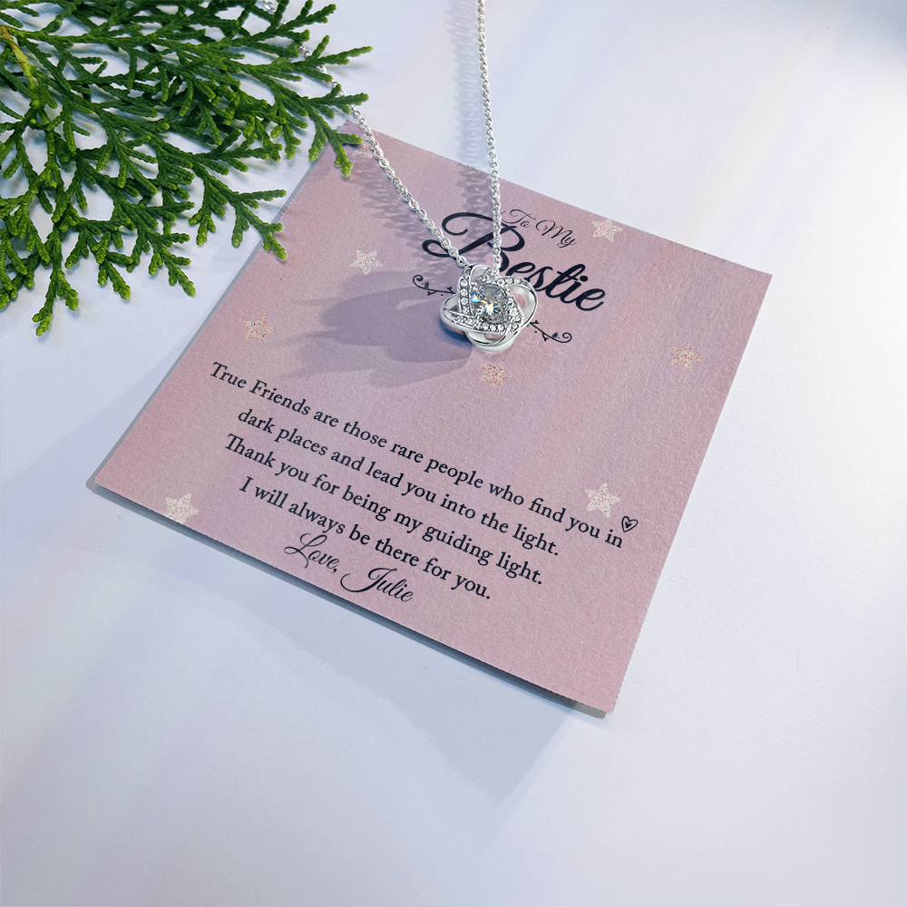 Love Knot Necklace with Personalized Message Card for Friend on a decorative background.