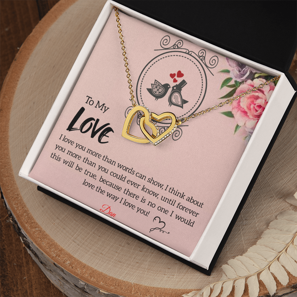 Interlocking hearts necklace with personalized message card in gift box.