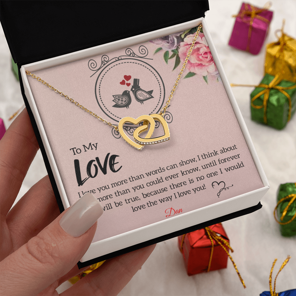 Interlocking hearts necklace with personalized message card in gift box.