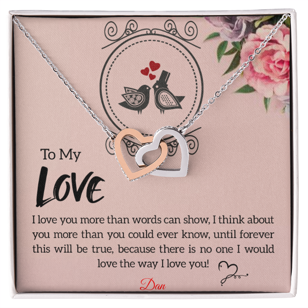 Interlocking hearts necklace with personalized message card and cubic zirconia accents.