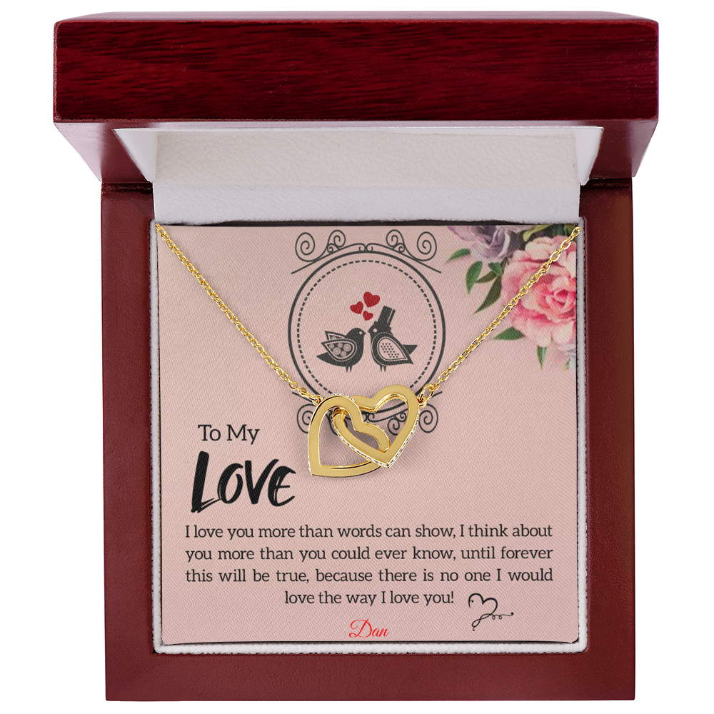 Interlocking hearts necklace with personalized message card in luxury mahogany-style box.