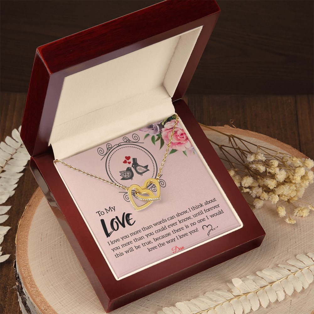 Interlocking hearts necklace in mahogany-style box with personalized message card.