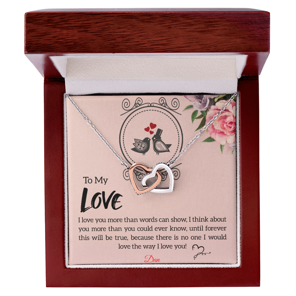 Interlocking hearts necklace with personalized message card in luxury box.