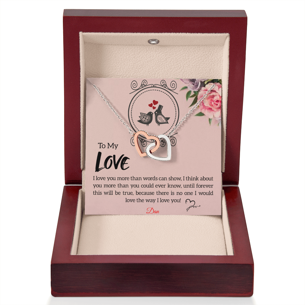 Interlocking hearts necklace with personalized message card in luxury mahogany-style box.