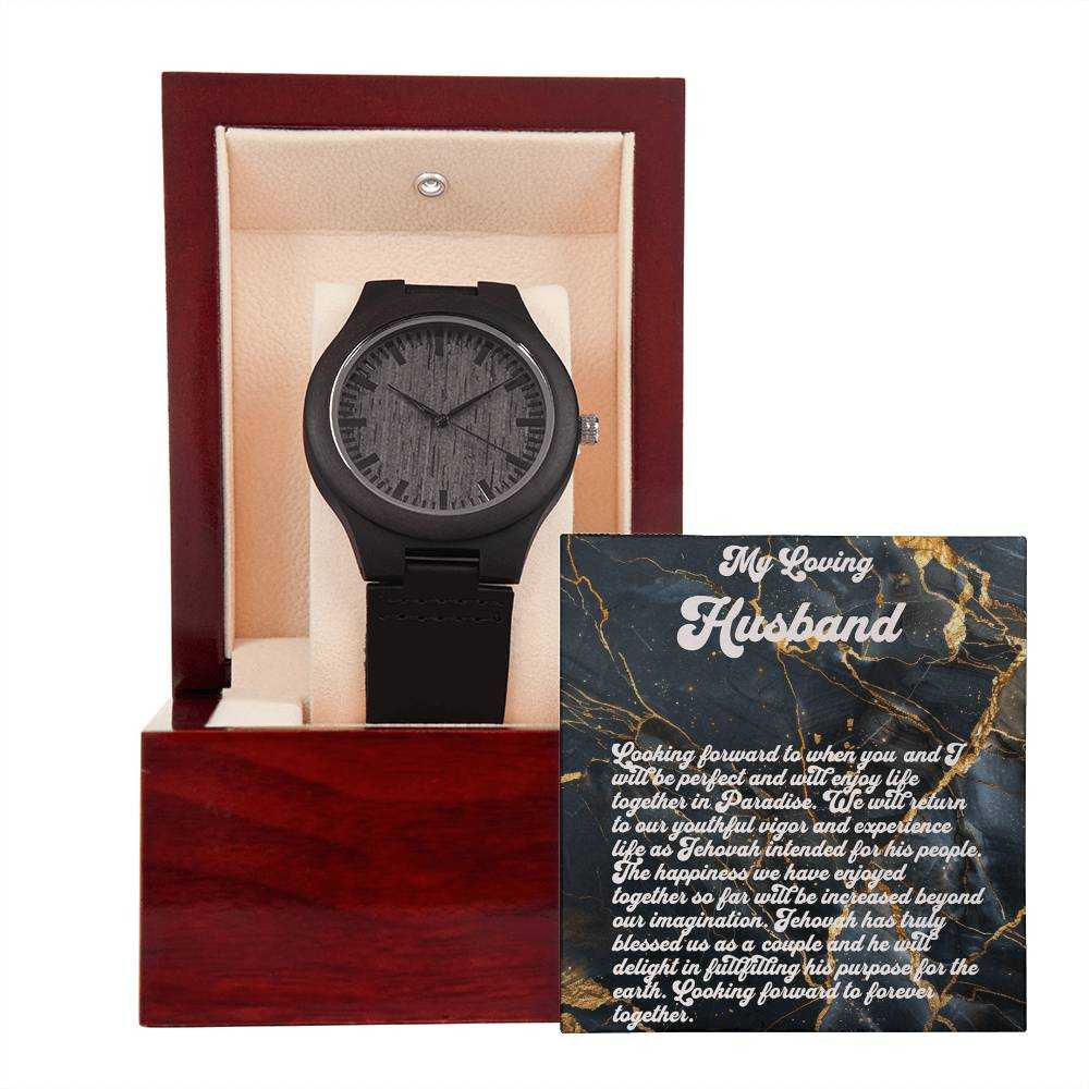 Wooden watch with sandalwood casing and black leather strap in a gift box, accompanied by a sentimental card for husbands.