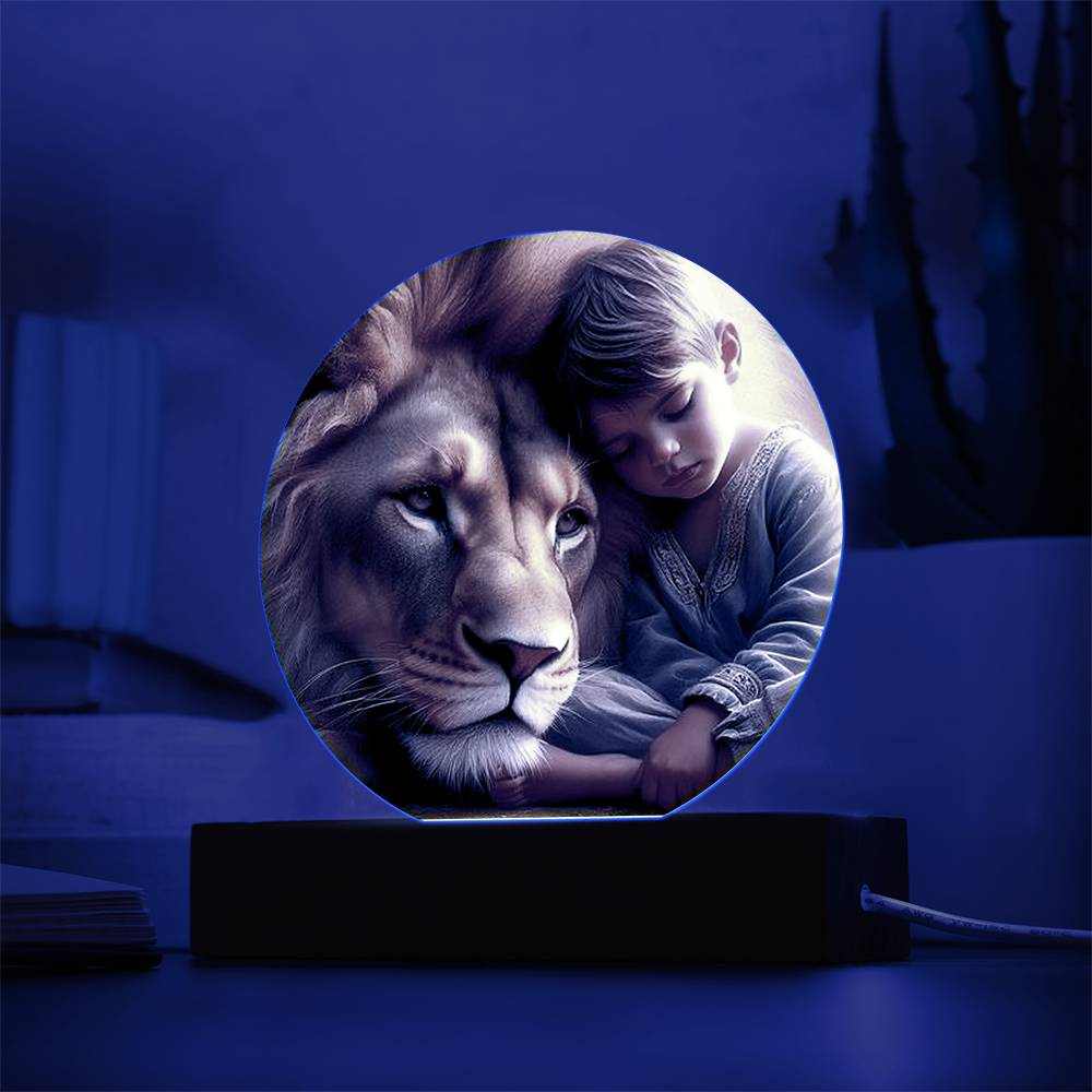 Acrylic LED night light featuring a lion and boy with customizable vibrant colors on a stylish wooden base.