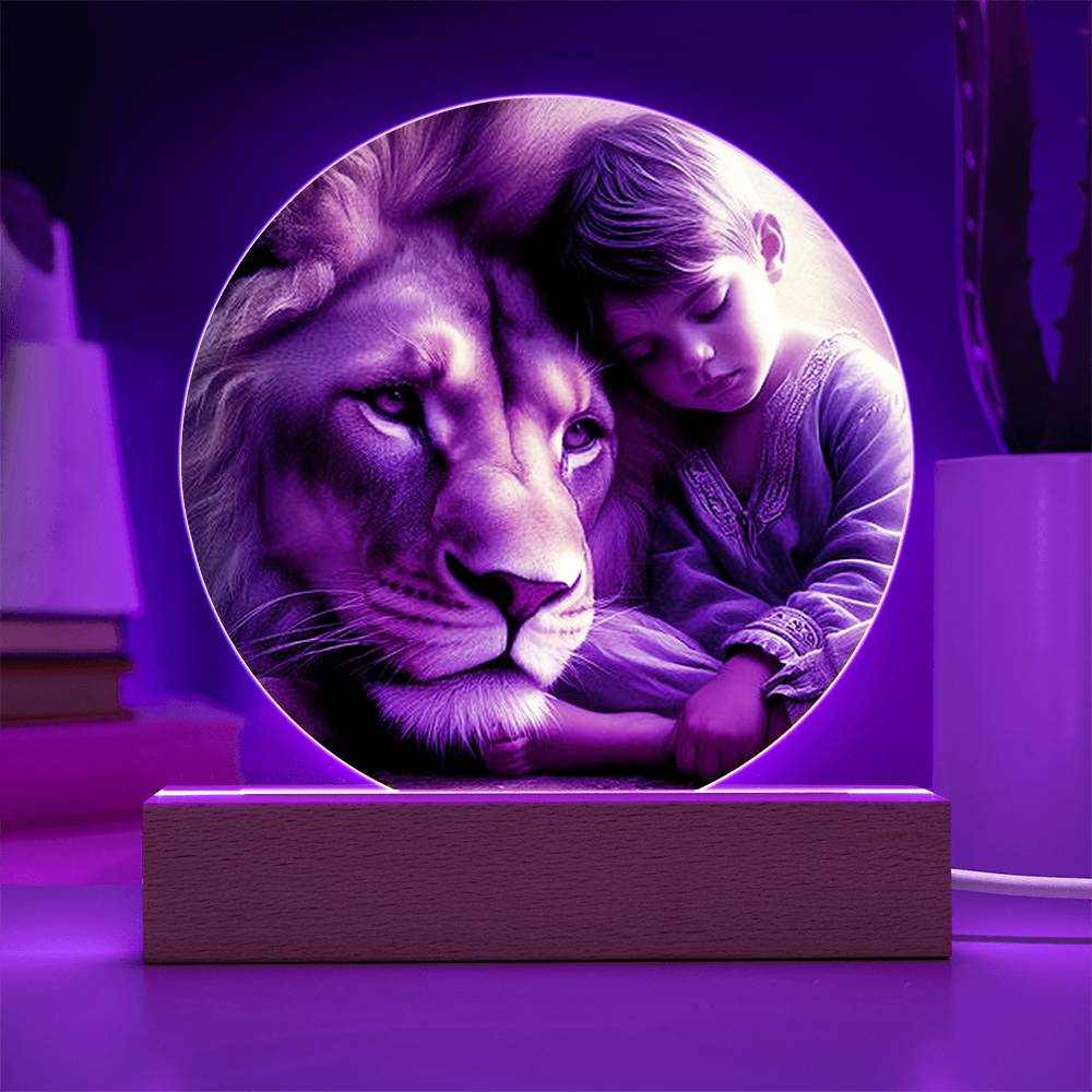 Acrylic LED night light featuring lion and boy with vibrant color options on wooden base.