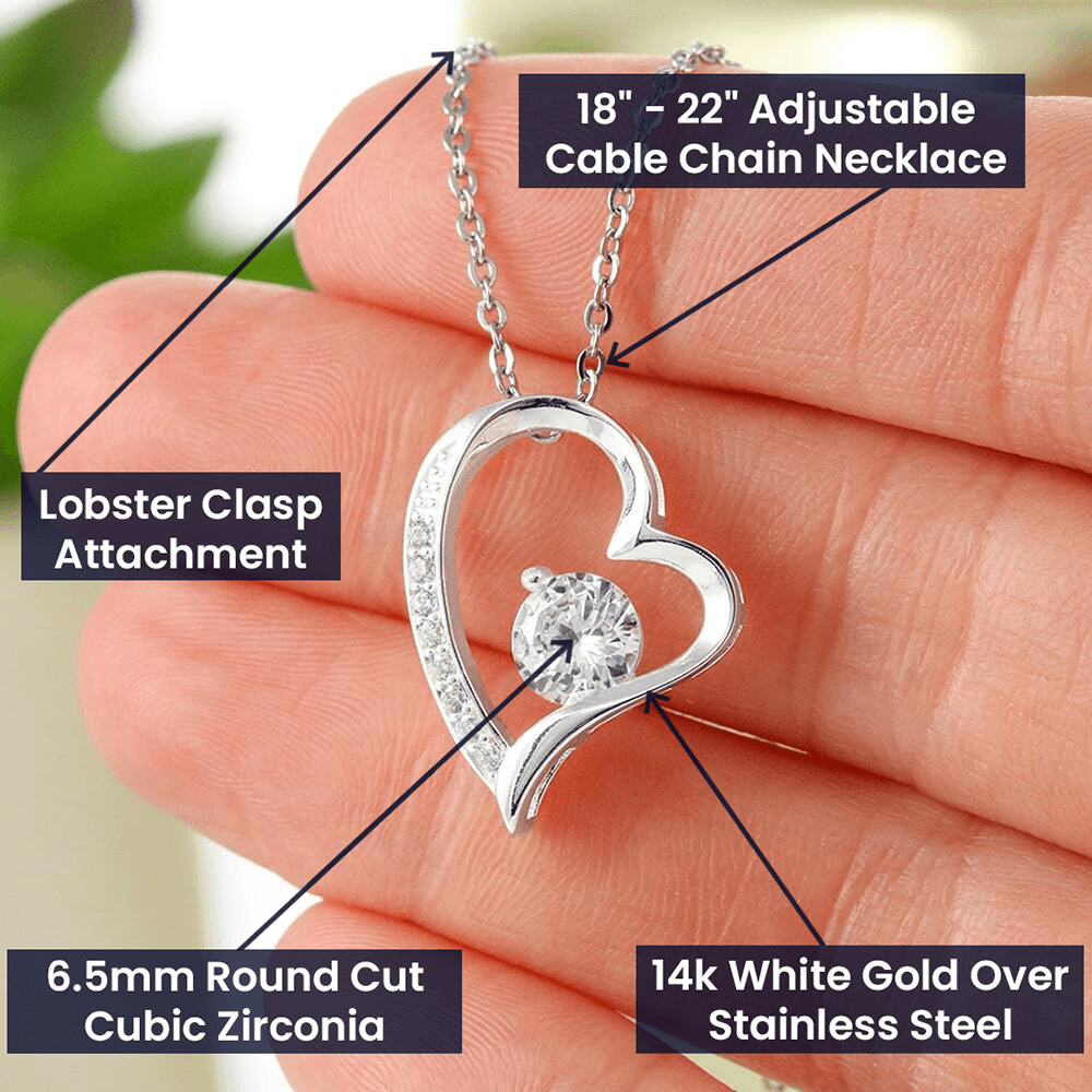 Heart-shaped necklace with 6.5mm cubic zirconia, 14k white gold finish, and adjustable 18"-22" chain.