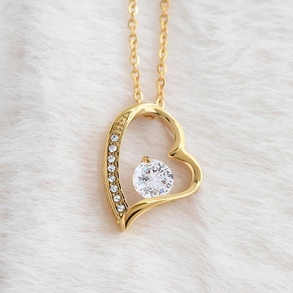 Heart-shaped gold necklace with cubic zirconia, personalized for sister.