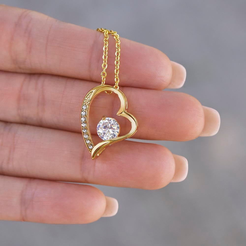 Gold heart pendant necklace with cubic zirconia crystal, perfect gift for sister.