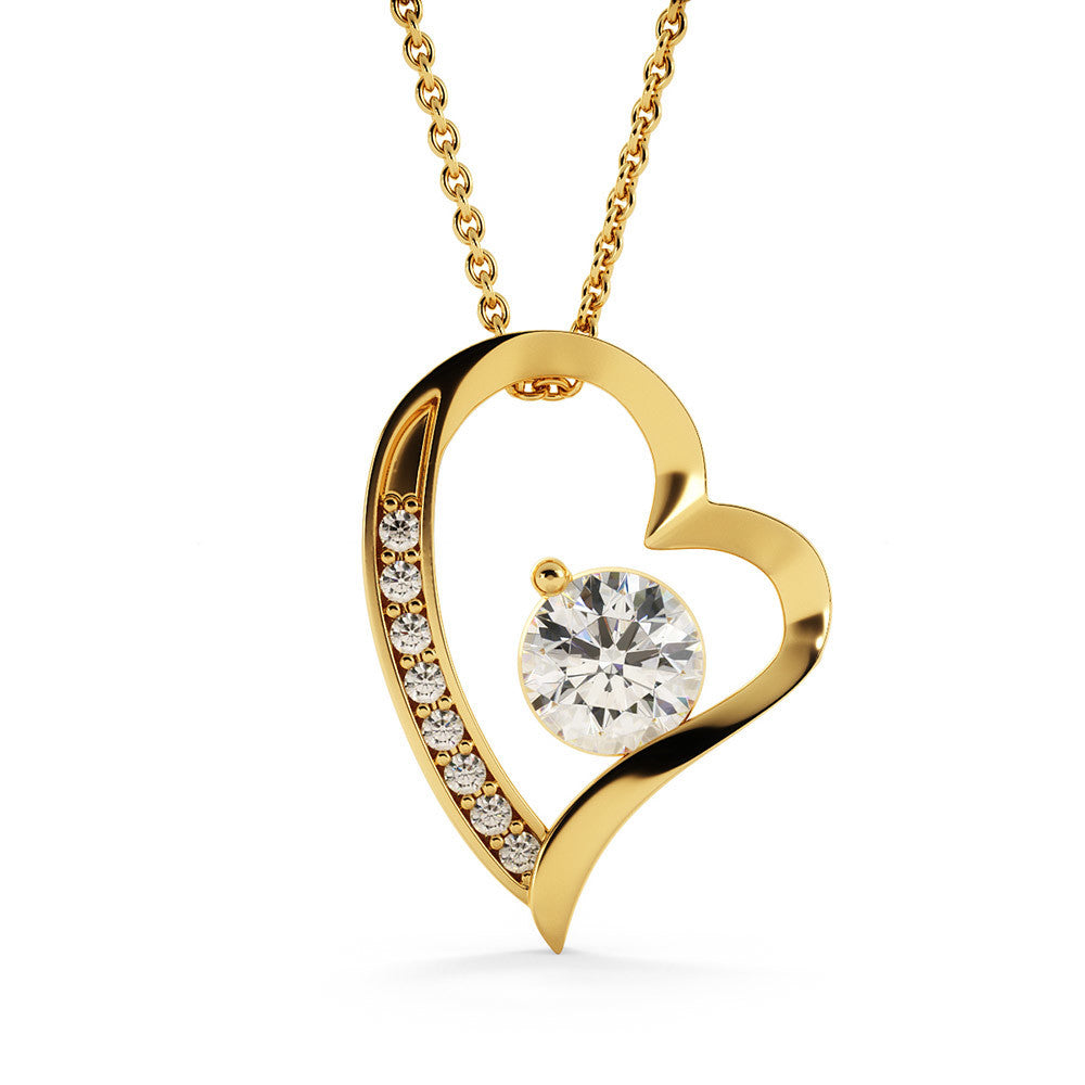 Forever Love Necklace with cubic zirconia crystal and heart pendant on a gold chain.