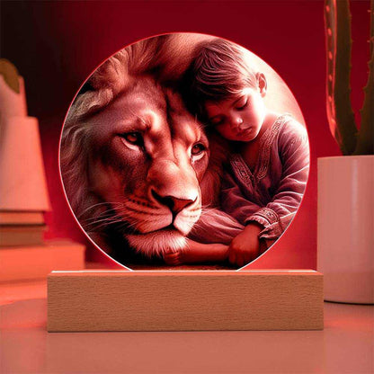 Acrylic LED night light featuring lion and boy on wooden base with customizable color options.