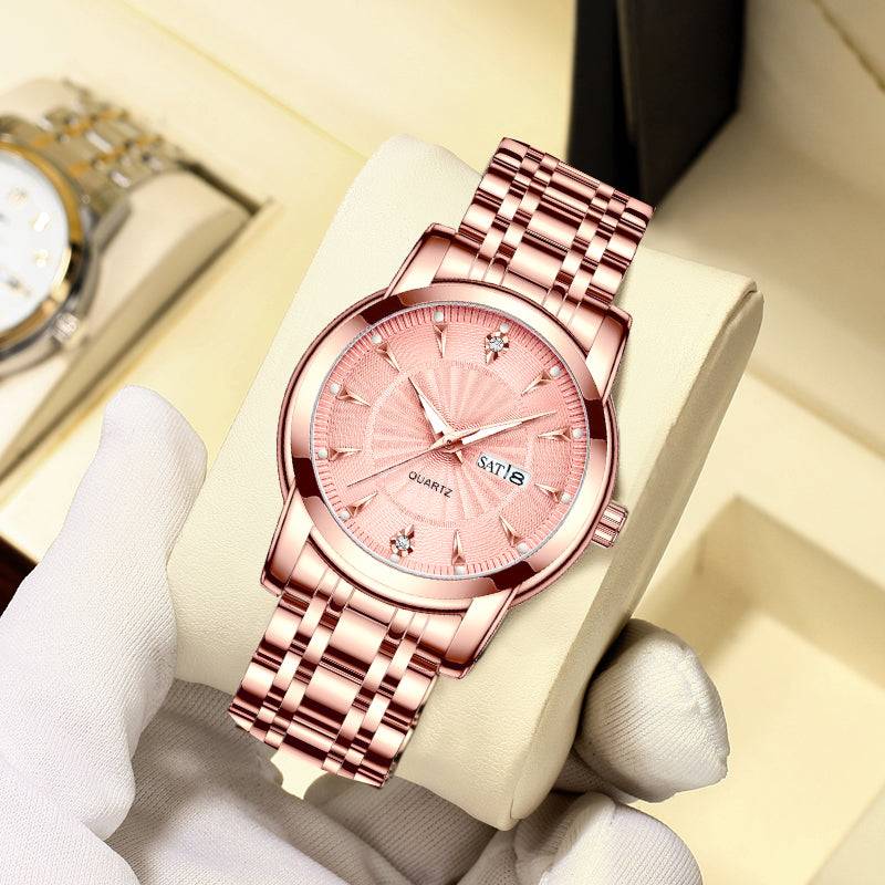 Rose gold stainless steel ladies' watch with date display and cubic zirconia accents on a cushion.