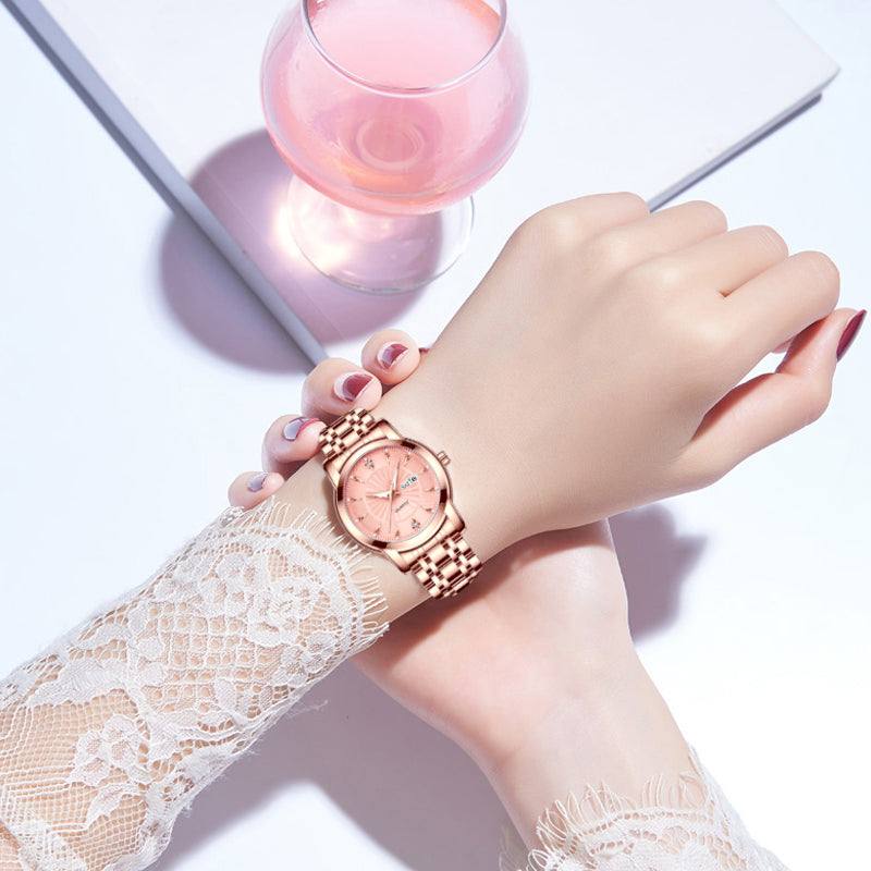 Elegant rose gold ladies' watch with personalized message stand, featuring luxurious gold-colored band and stunning design for special occasions.